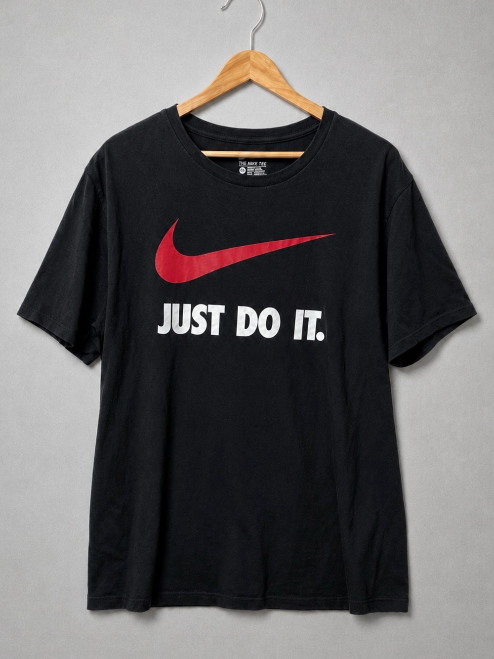 Nike Black Short Sleeve Tee with Red Swoosh and White Text